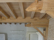 the-ends-of-the-beams-have-been-carved-into-boars-heads-in-the-manor-house-kitchen